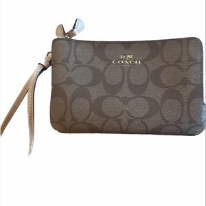 Coach wristlet:lt brown edge double zipped